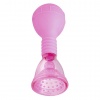 Malá vakuová pumpička na klitoris nebo bradavky v růžové barvě.