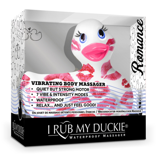 Bílá masážní vibrační kachnička s růžovými polibky Romance v balení.