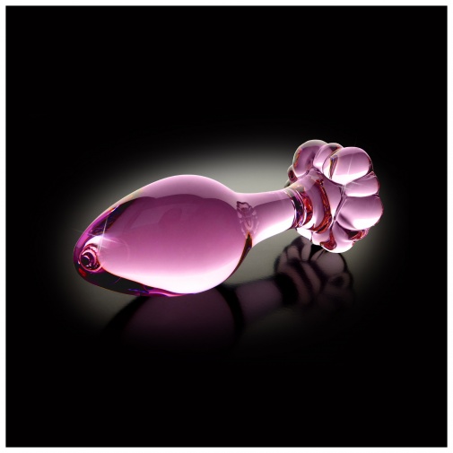 Elegantní skleněný anální kolík Icicles No. 48 se základnou v podobě květinky v růžové barvě.