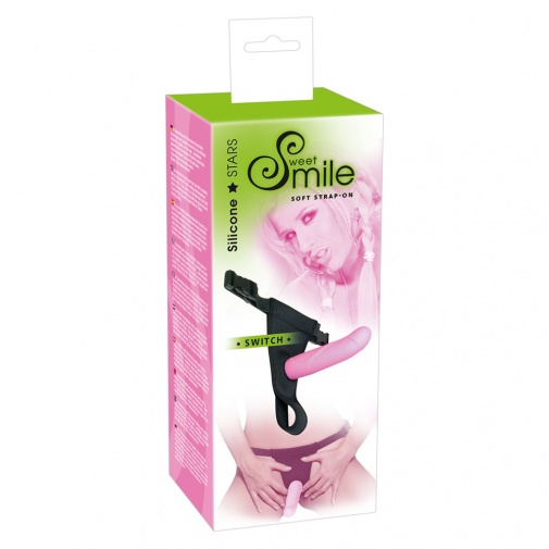 Balení růžového připínacího dilda s nastavistelným postrojem - Sweet Smile Switch.