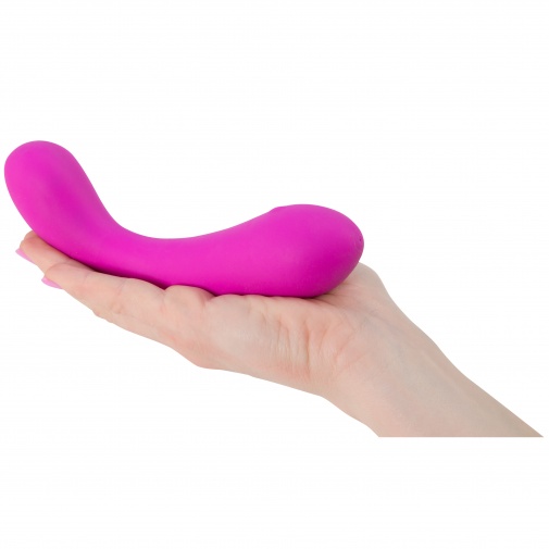 Silikonový růžový vibrátor The Swan Curve Squeeze control v ruce.