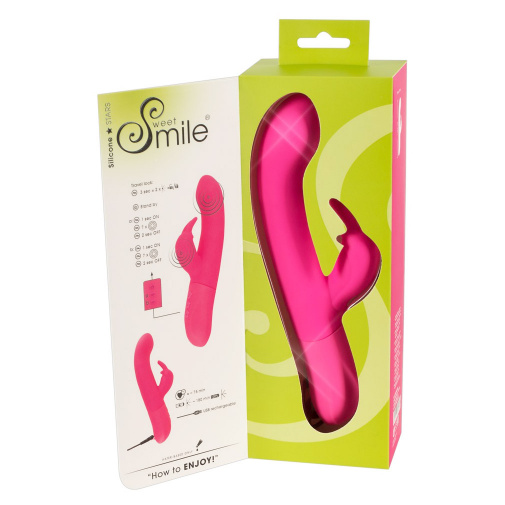Růžový dobíjecí vibrátor se stimulátorem klitorisu Sweet Smile G-bod Rabbit v balení.