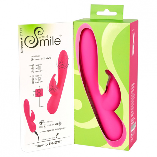 Růžový dobíjecí G-bod vibrátor se stimulátorem klitorisu Sweet Smile Rabbit v balení.