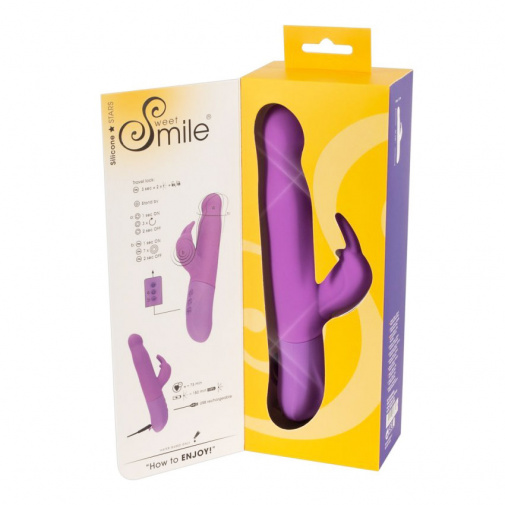 Fialový dobíjecí rotační vibrátor se stimulátorem klitorisu Sweet Smile Rotating Rabbit v balení.