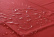 Červená vodotěsná PVC plachta na postel.